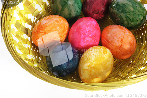 Image of Colourful painted Easter Eggs in a basket