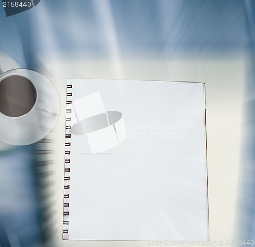 Image of White cup and white page