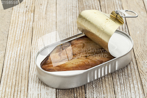 Image of herring in open can