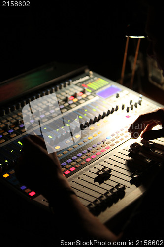 Image of Person mixing music