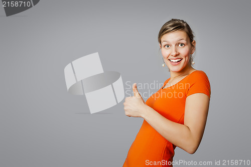 Image of young woman thumb up