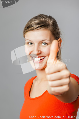 Image of young woman thumb up