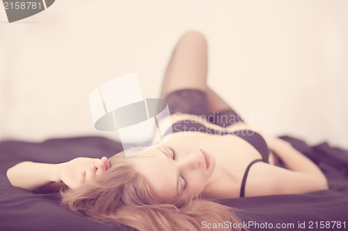 Image of Girl lying on the bed