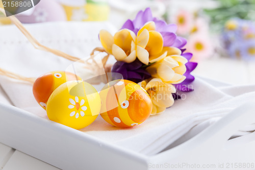 Image of Easter eggs with spring flowers