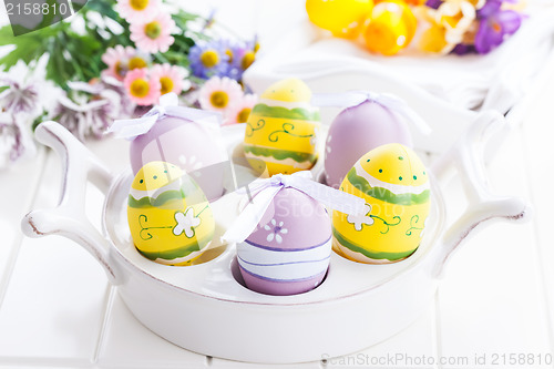 Image of Easter eggs with spring flowers