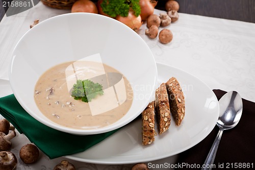 Image of fresh chmapignon cream soup with parsley