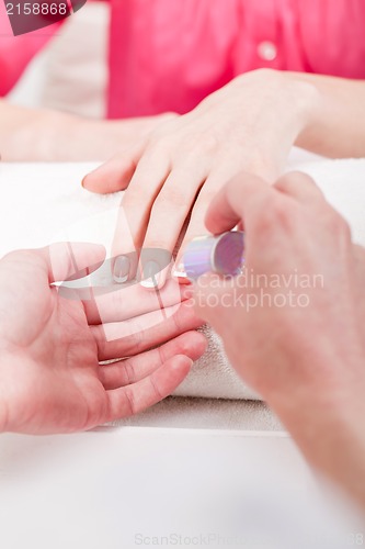 Image of manicure making in beauty spa salon 