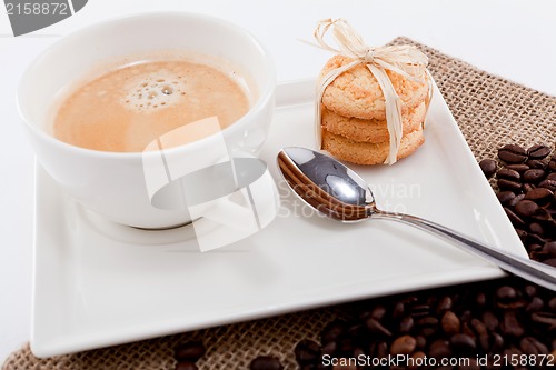 Image of fresh aromatic coffee and cookies on table