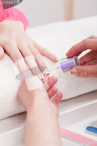 Image of manicure making in beauty spa salon 