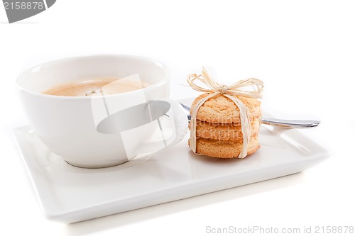 Image of fresh aromatic coffee and cookies on table