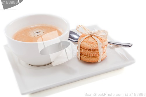 Image of fresh aromatic coffee and cookies on table