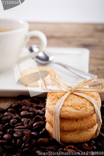 Image of fresh aromatic coffee and cookies on table