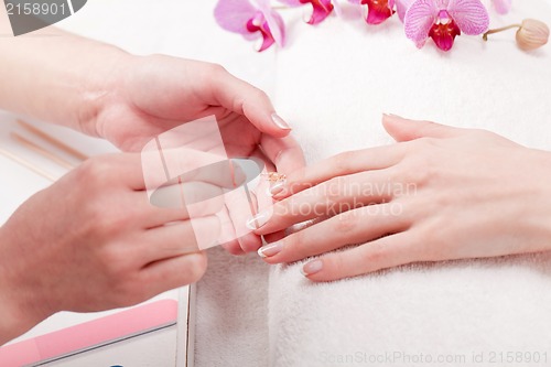 Image of manicure making in beauty spa salon 