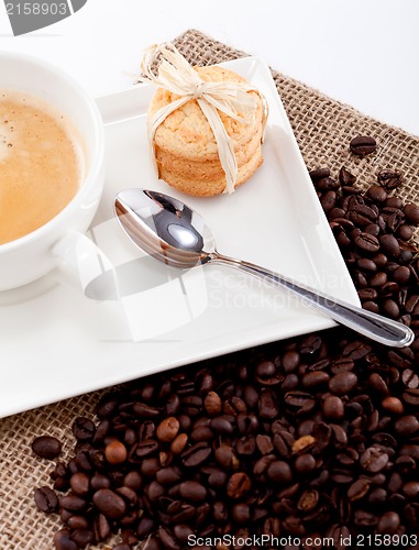 Image of fresh aromatic coffee and cookies on table