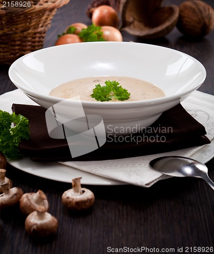 Image of fresh chmapignon cream soup with parsley