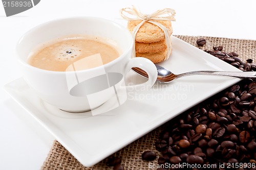 Image of fresh aromatic coffee and cookies on table