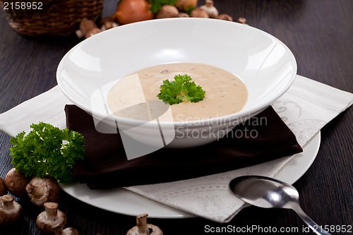 Image of fresh chmapignon cream soup with parsley
