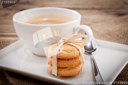 Image of fresh aromatic coffee and cookies on table