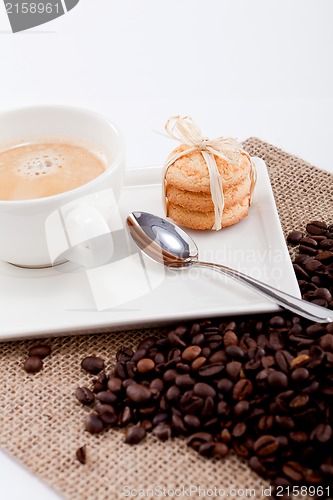 Image of fresh aromatic coffee and cookies on table