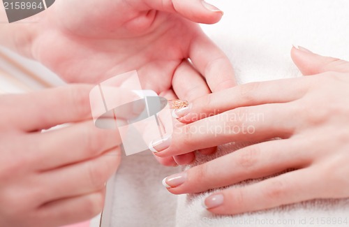 Image of manicure making in beauty spa salon 