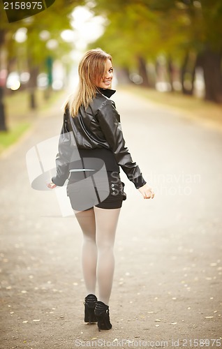 Image of young brunette woman portrait in autumn color