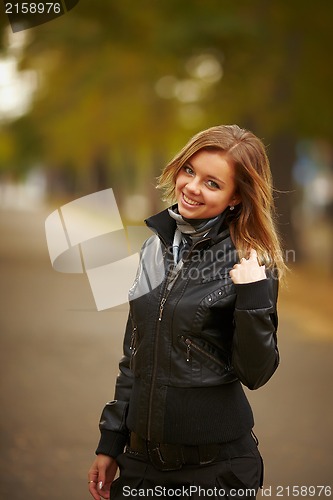 Image of young brunette woman portrait in autumn color