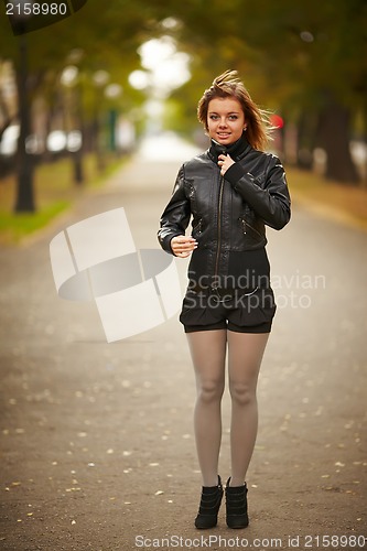 Image of young brunette woman portrait in autumn color