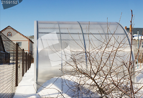 Image of A small greenhouse is made of polycarbonate winter