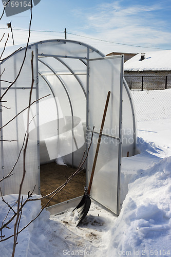 Image of A small greenhouse in winter