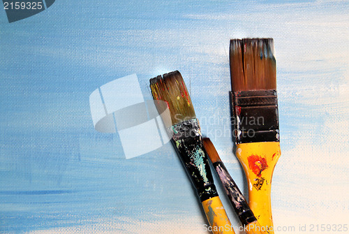 Image of Art palette and paintbrushes