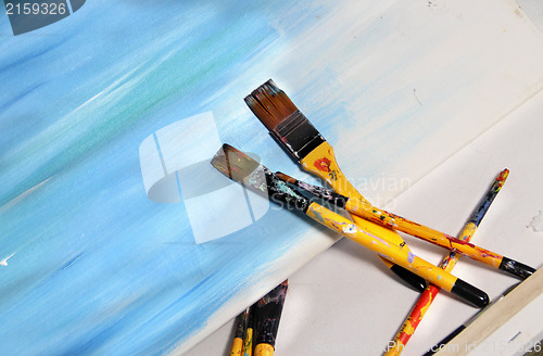 Image of Art palette and paintbrushes