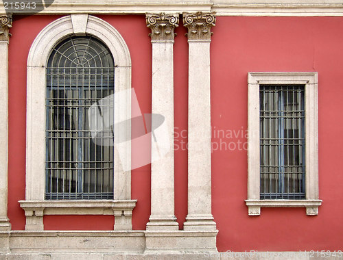 Image of Red wall and ornate windows