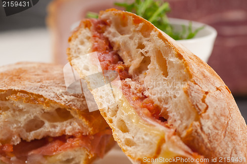 Image of ciabatta panini sandwich with parma ham and tomato