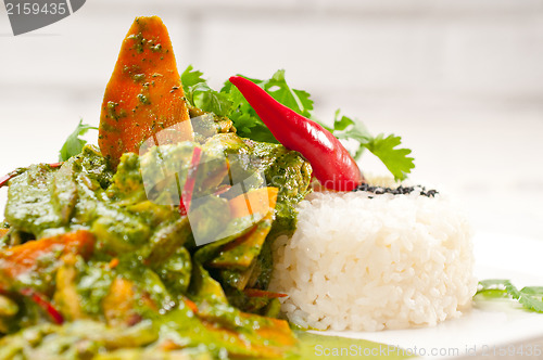 Image of chicken with green curry vegetables and rice