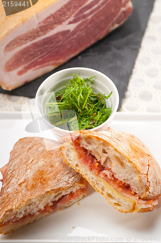 Image of ciabatta panini sandwich with parma ham and tomato