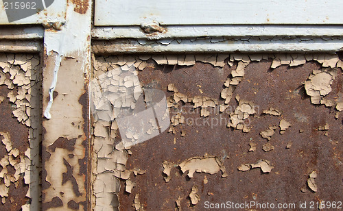 Image of Peeling paint on rusty surface