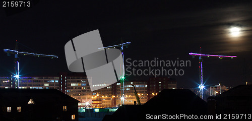 Image of construction site with tall cranes