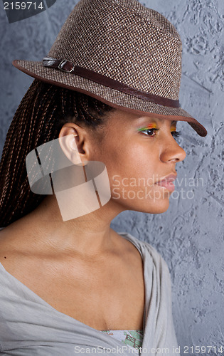 Image of yong woman in a hat