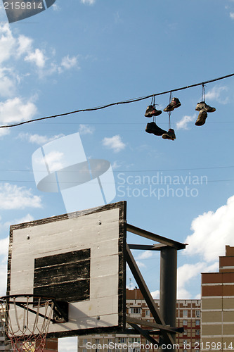 Image of Sneakers Hanging on a Telephone Line
