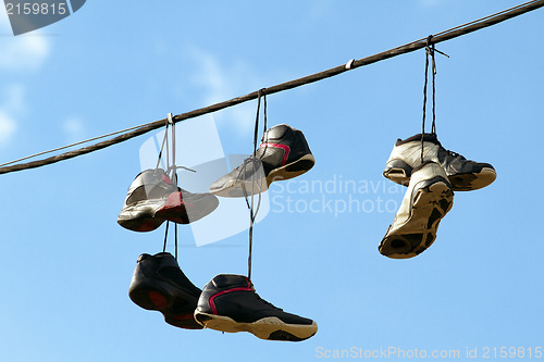 Image of Sneakers Hanging on a Telephone Line