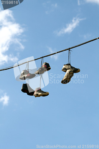 Image of Sneakers Hanging on a Telephone Line