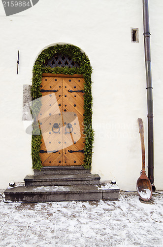 Image of The ancient door decorated to Christmas