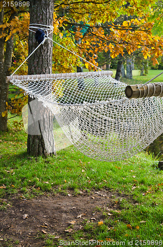 Image of A hammock near the pond in autumn Park 