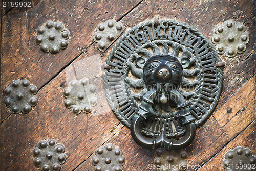 Image of Door Knocker on the door of an old building 