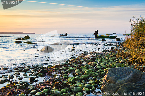 Image of Fishing boats on the coast of the Baltic Sea at sunset