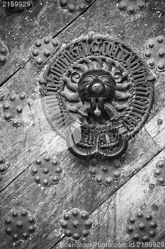 Image of Door Knocker on the door of an old building 