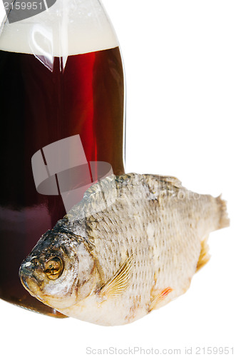 Image of A bottle of domestic beer and dried fish is isolated on white 