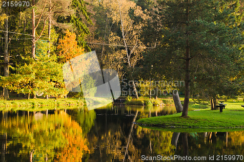 Image of Autumn park with a pond