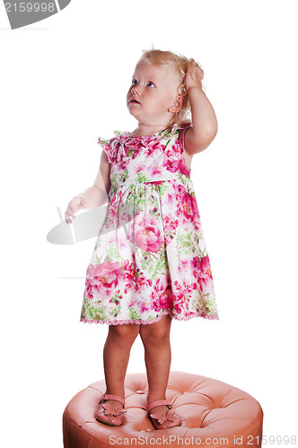 Image of Little girl looking up in surprise, it is isolated on white