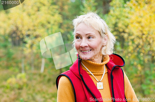 Image of Portrait of a woman middle aged outdoors in fall 